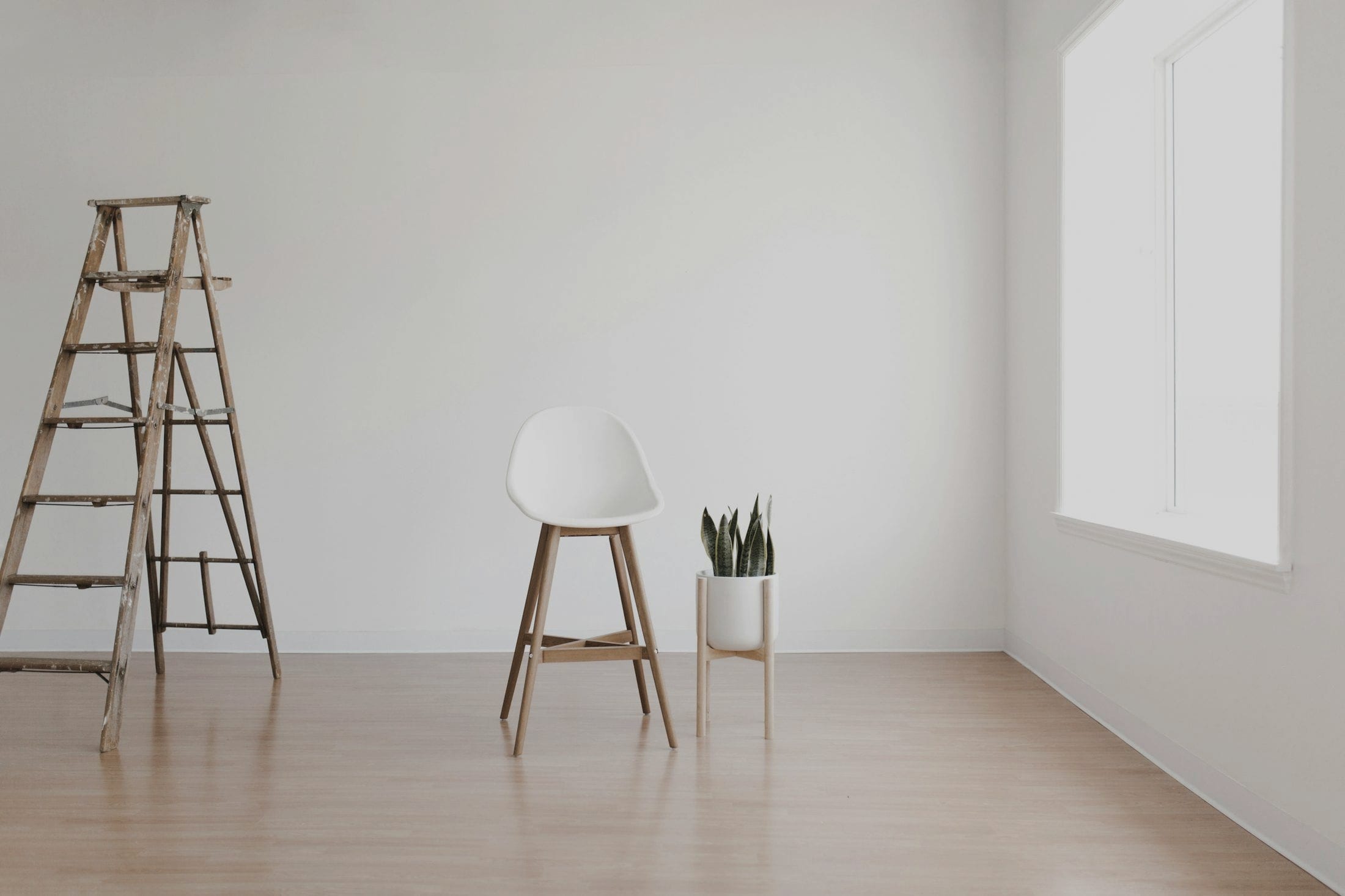 A quiet room in daylight, pale walls and a bare floor